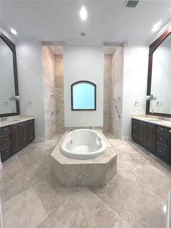 a bathroom with a bathtub and a sink