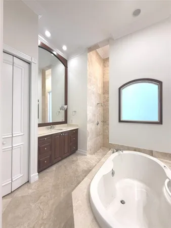 a bathroom with a bathtub and a sink