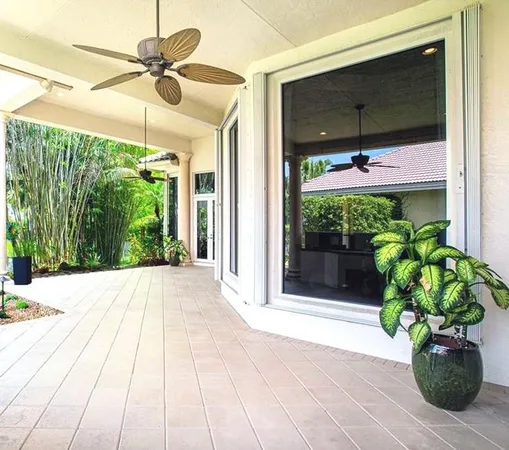 an aerial view of house with yard swimming pool and outdoor seating