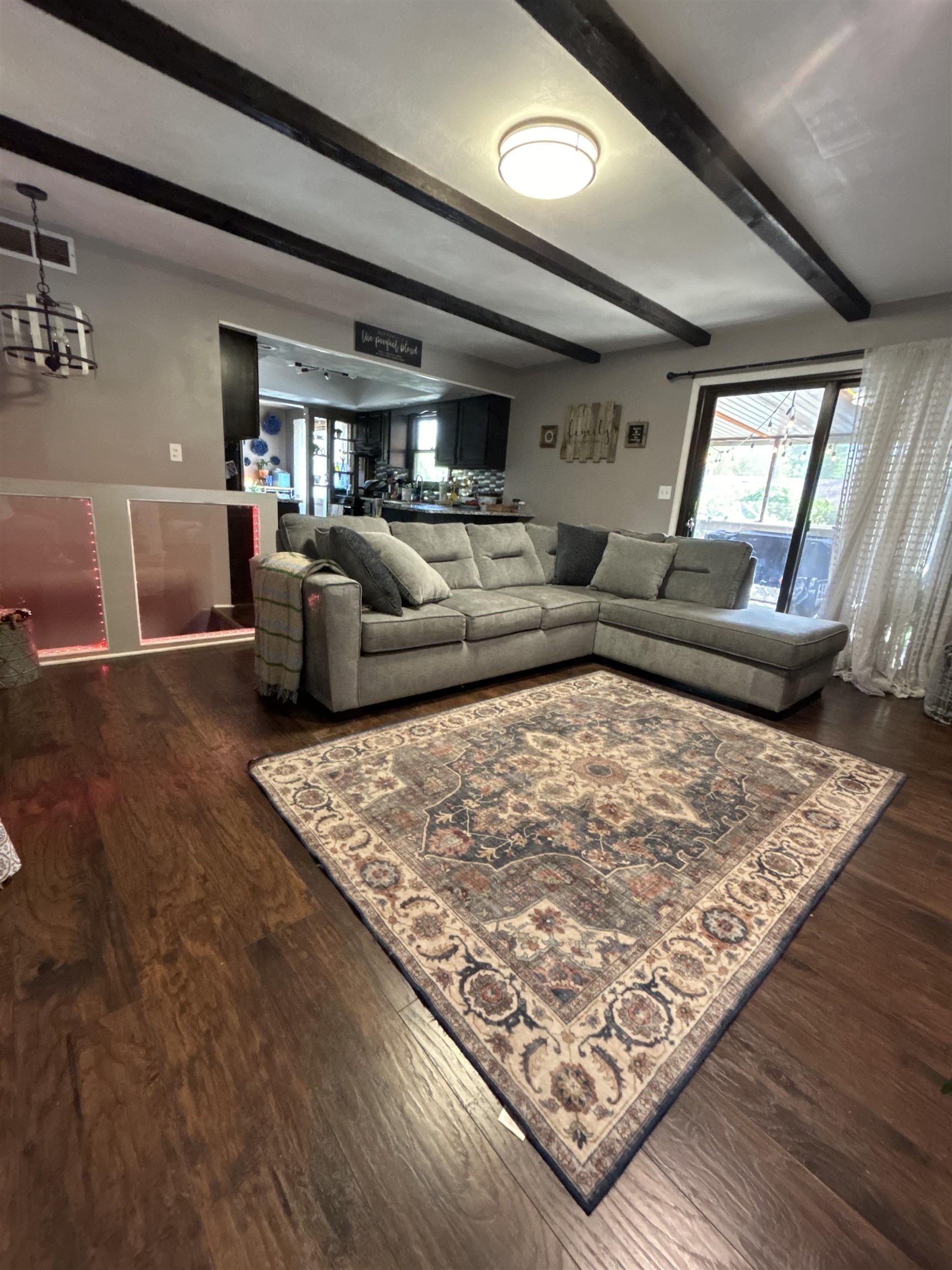 4563 Sunderman Road Rockford, IL 61114 - Photo 6 of 70 a living room with lots of furniture and a rug