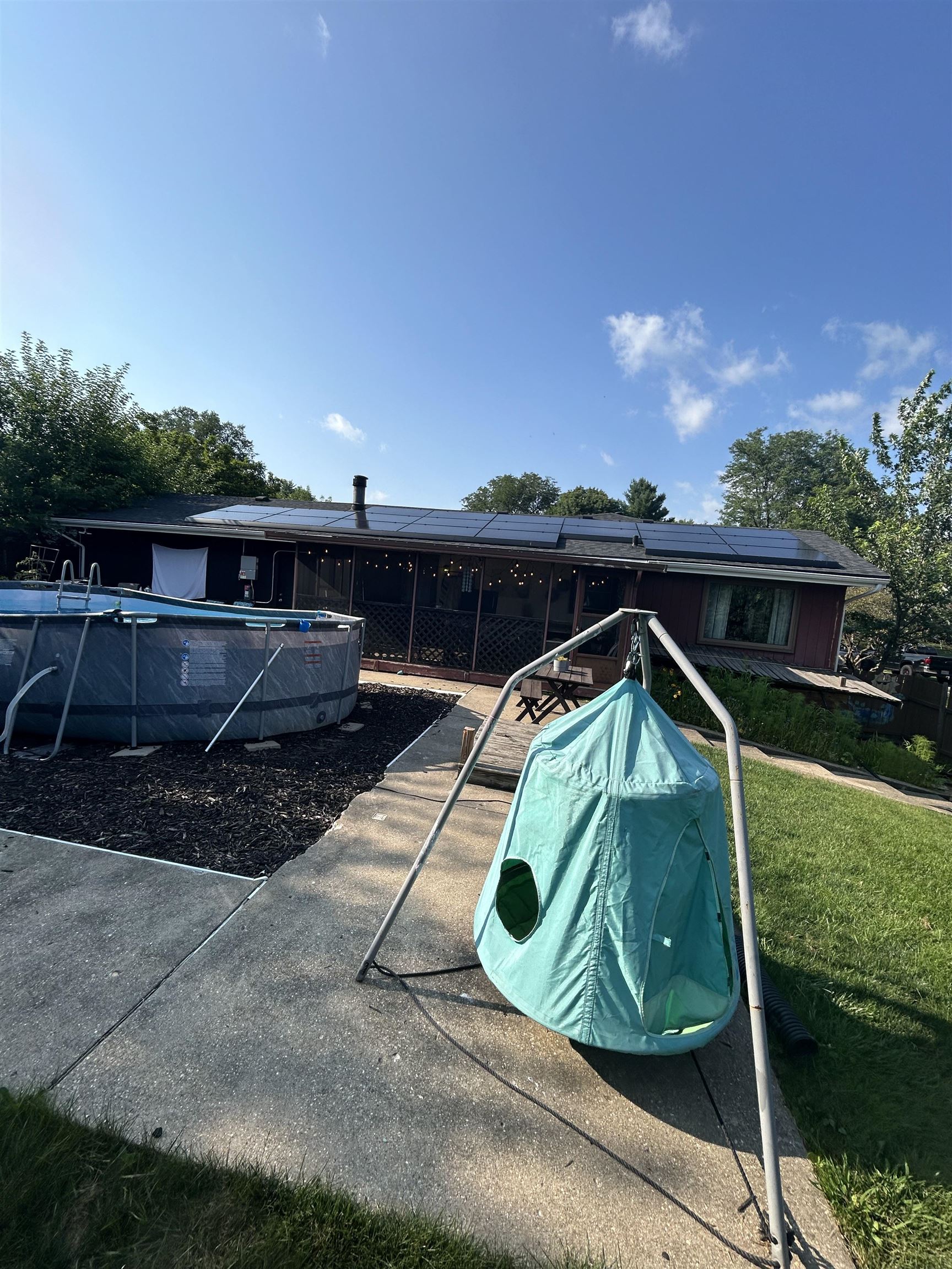 4563 Sunderman Road Rockford, IL 61114 - Photo 67 of 70 a view of roof deck with lawn chairs wooden floor and fence