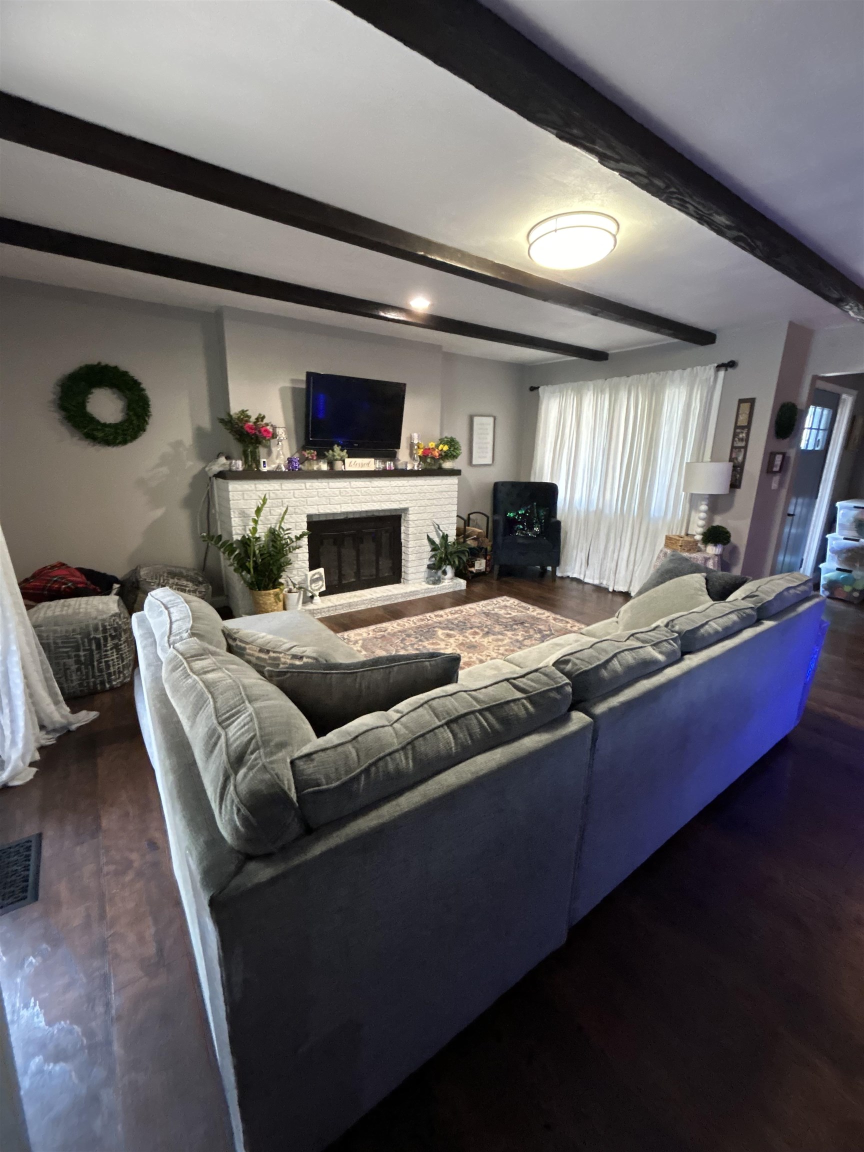 4563 Sunderman Road Rockford, IL 61114 - Photo 9 of 70 a living room with furniture and a fireplace