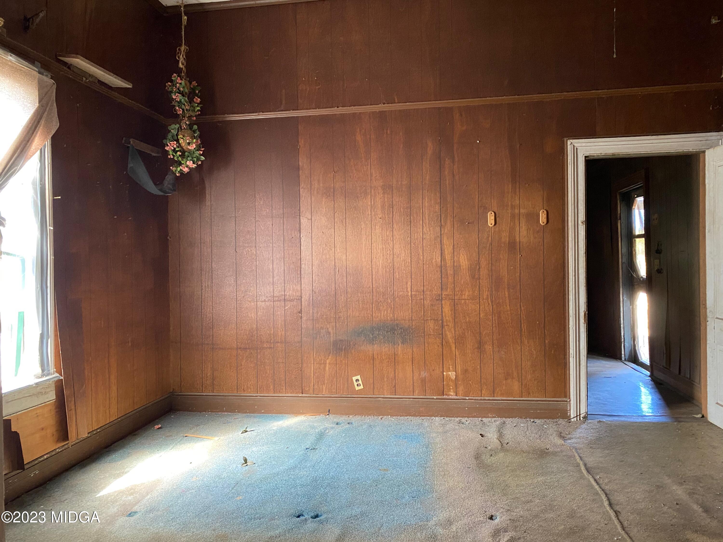 491 Barrow Road Reynolds, GA 31076 - Photo 17 of 56 an empty room with windows and entrance