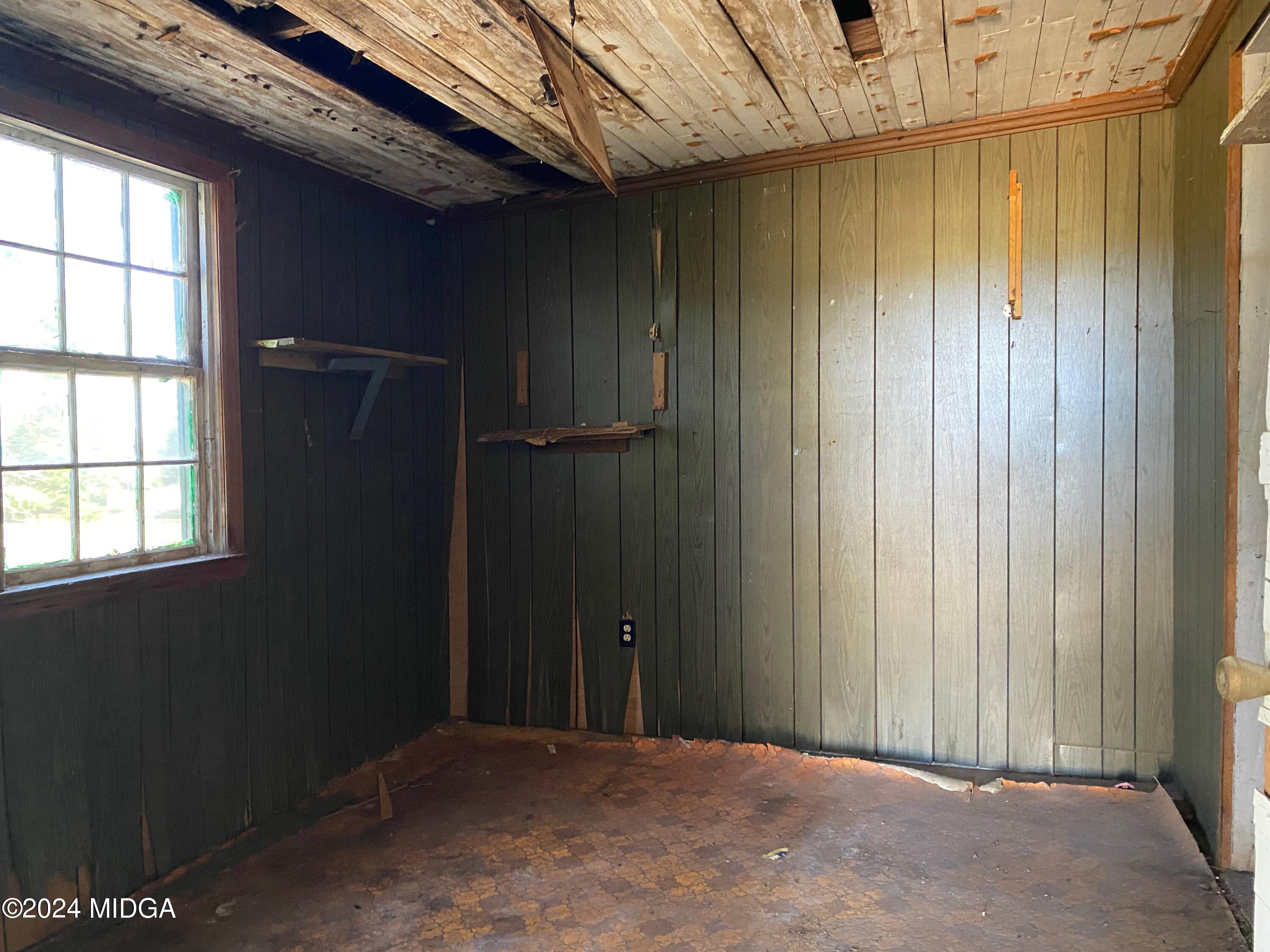 491 Barrow Road Reynolds, GA 31076 - Photo 42 of 56 a view of a room with a wooden door