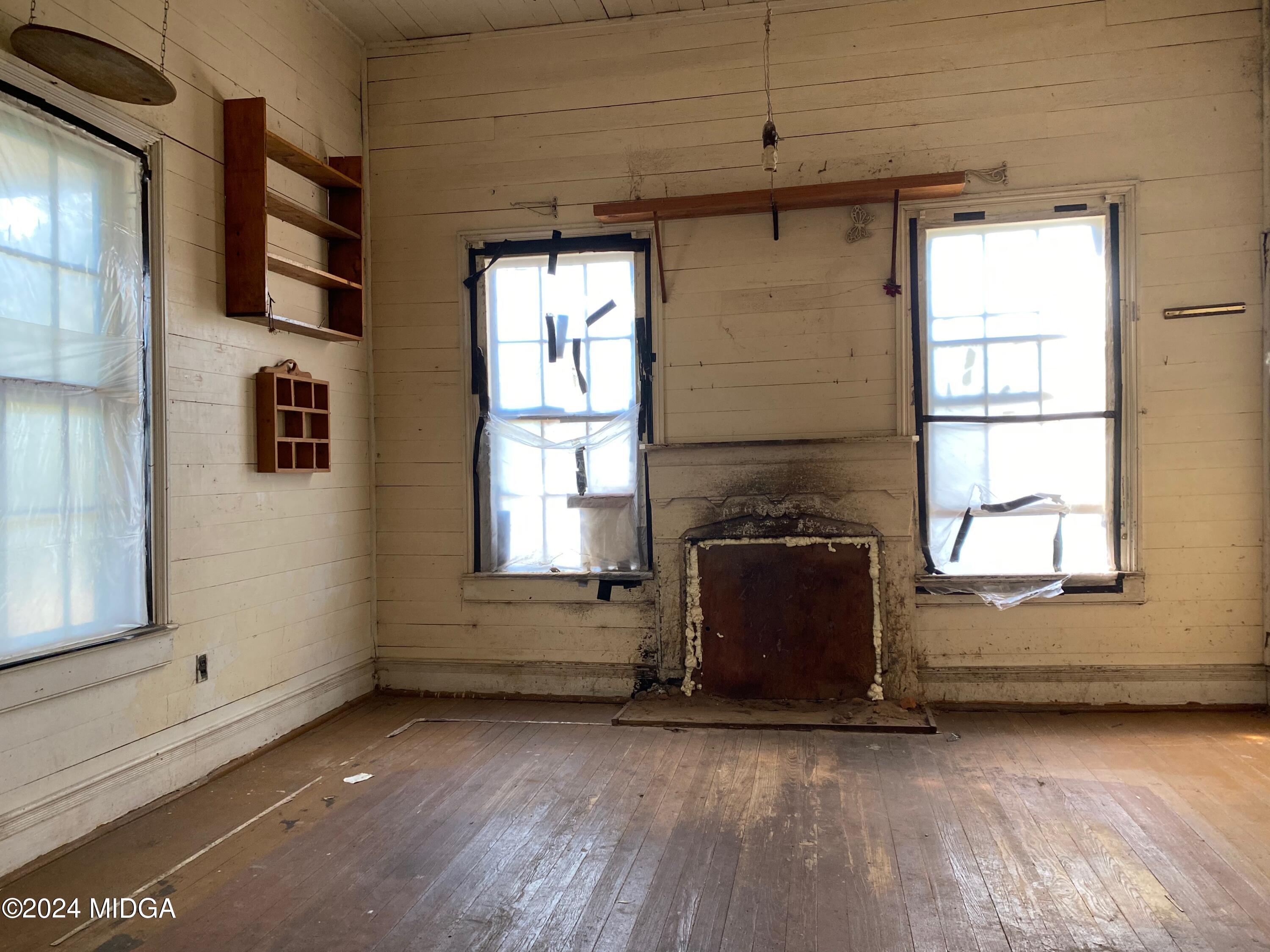 491 Barrow Road Reynolds, GA 31076 - Photo 47 of 56 a view of a livingroom with wooden floor and a window