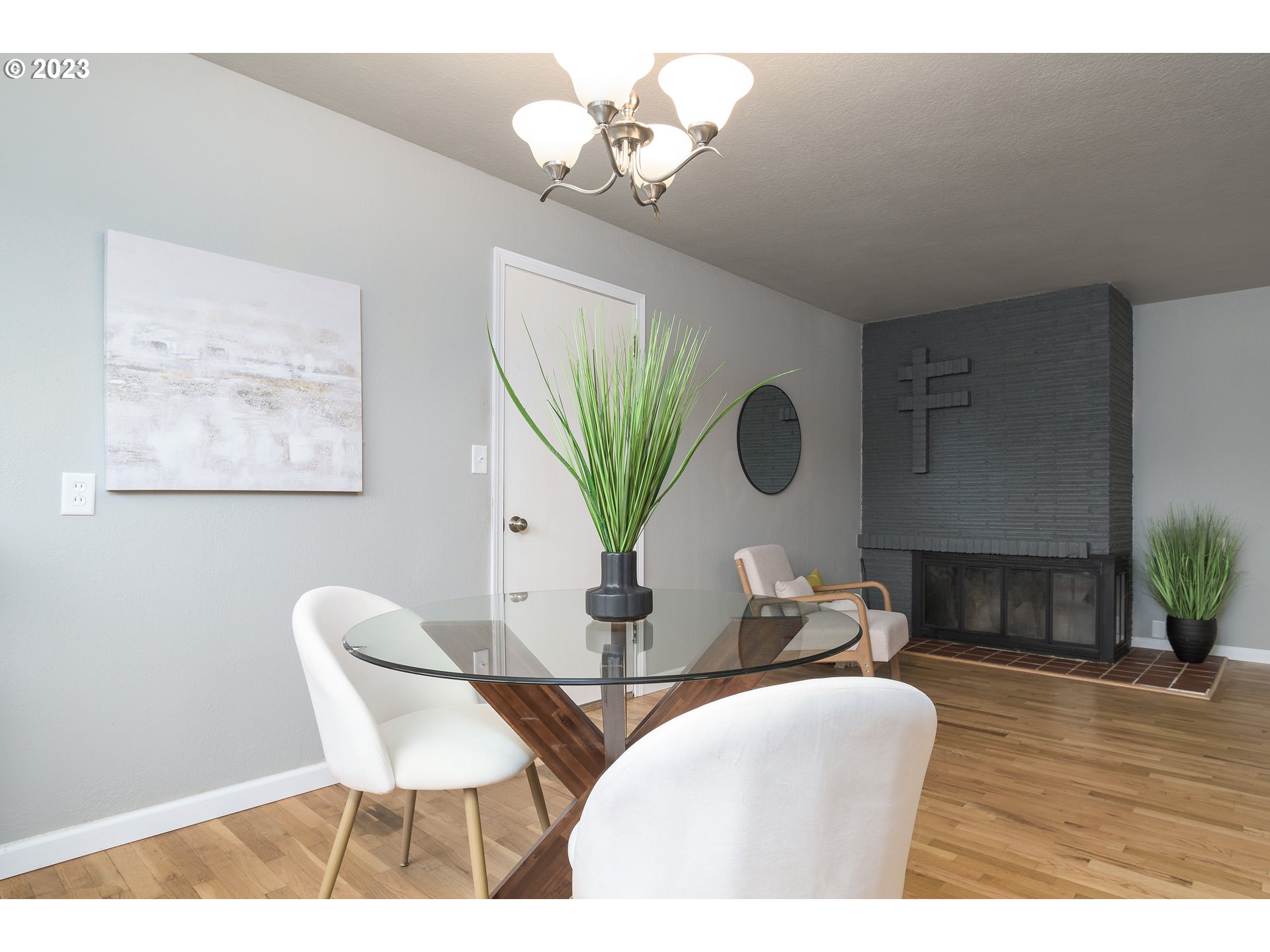 1730 Market Street Springfield, OR 97477 - Photo 13 of 43 a dining room with furniture a chandelier and wooden floor
