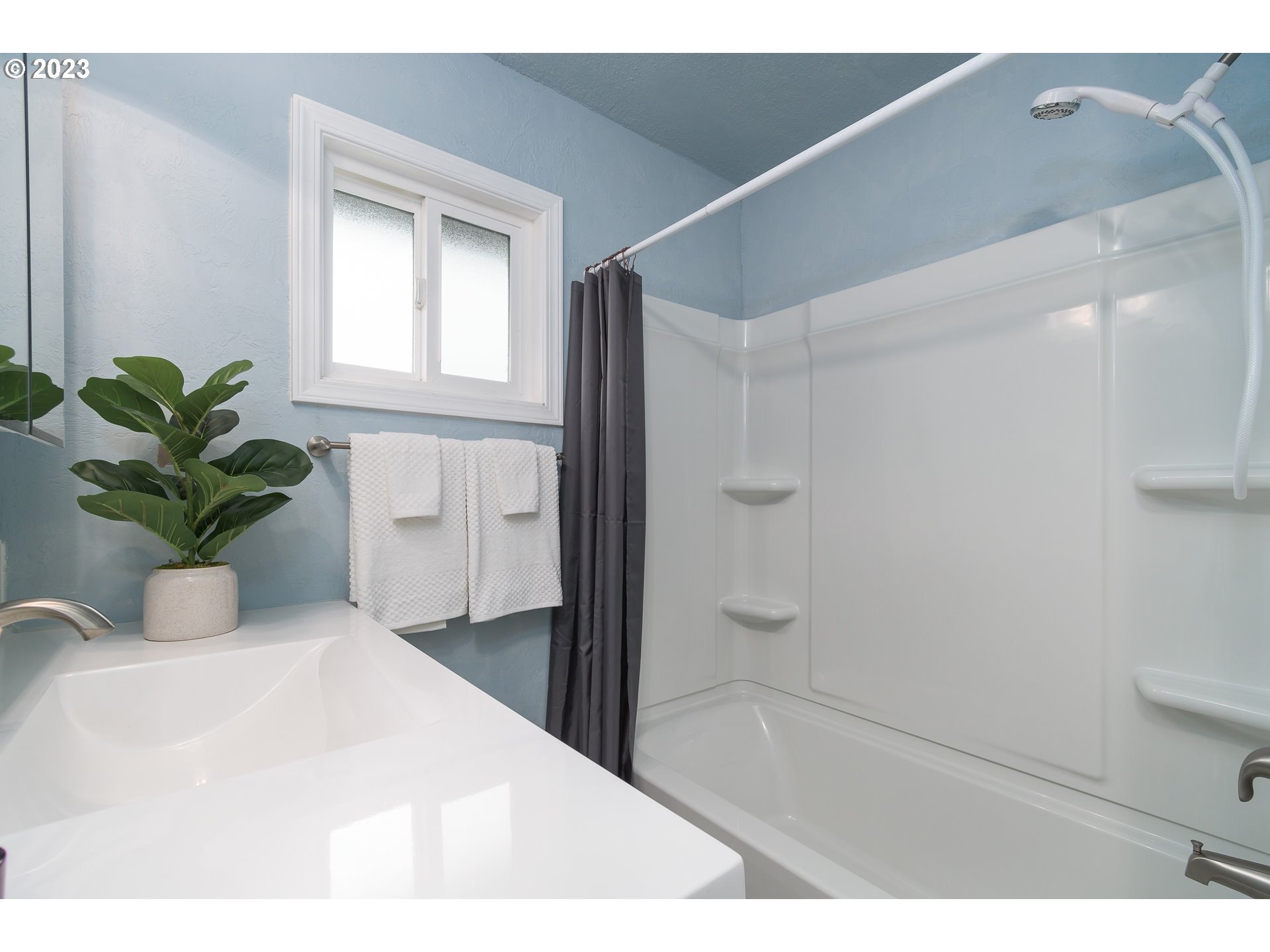 1730 Market Street Springfield, OR 97477 - Photo 19 of 43 a bathroom with a bathtub and a shower