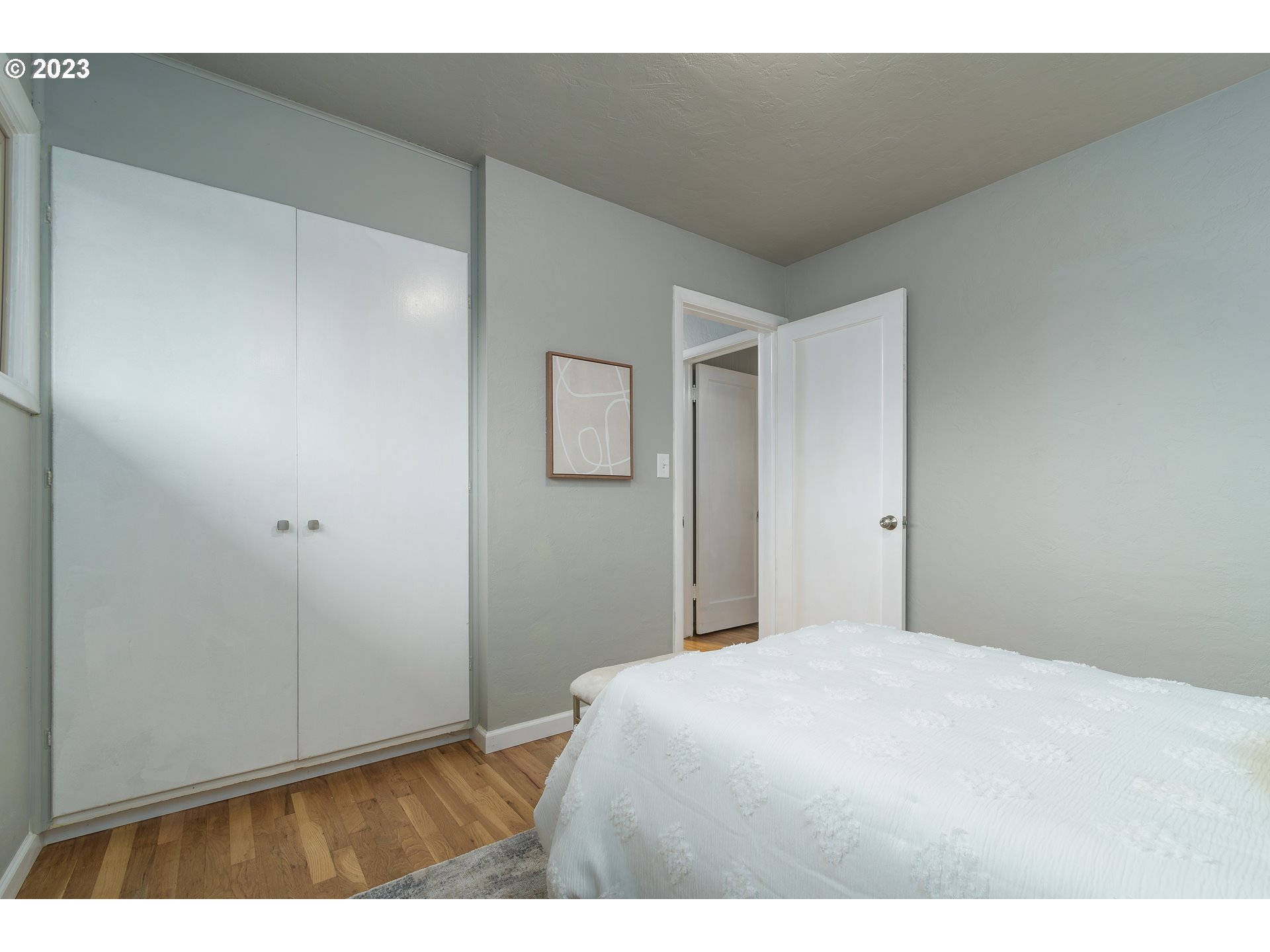 1730 Market Street Springfield, OR 97477 - Photo 21 of 43 a bedroom with a bed and a night stand