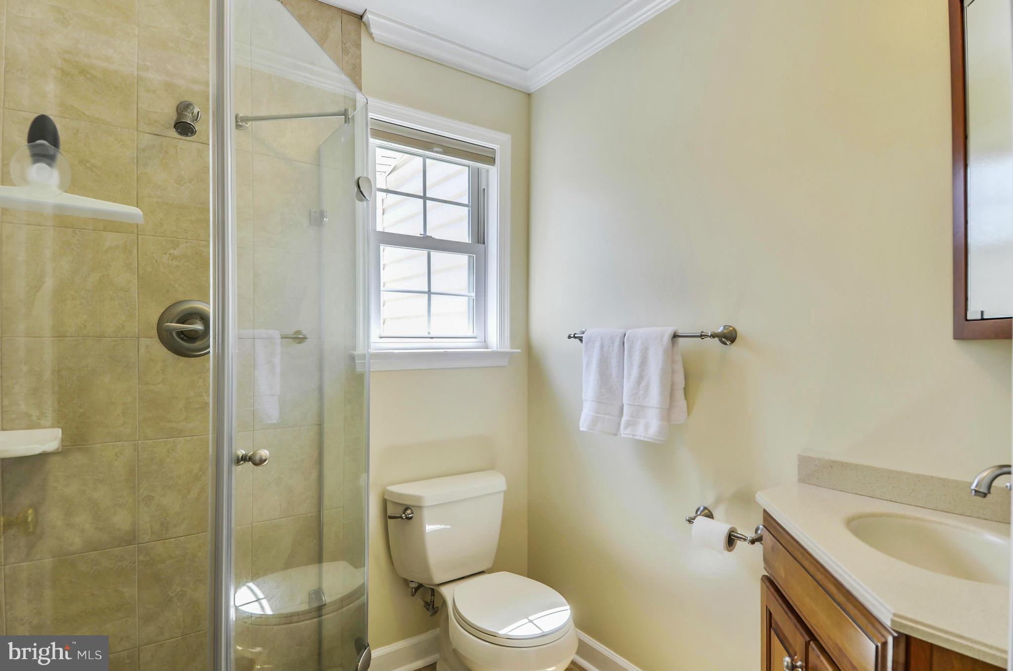 16022 Riffle Ford Road Gaithersburg, MD 20878 - Photo 22 of 30 a white toilet sitting next to a bathroom sink