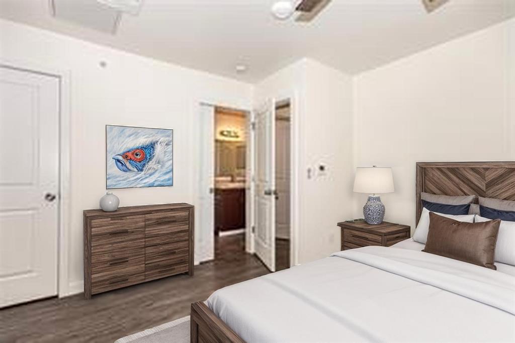 3022 Forest Lane, Unit 110 Dallas, TX 75234 - Photo 10 of 12 a bedroom with a bed and a couch