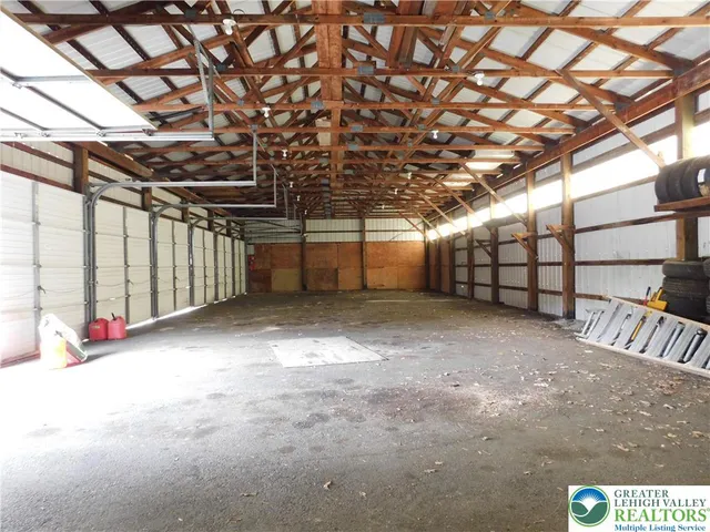 a view of porch with garage