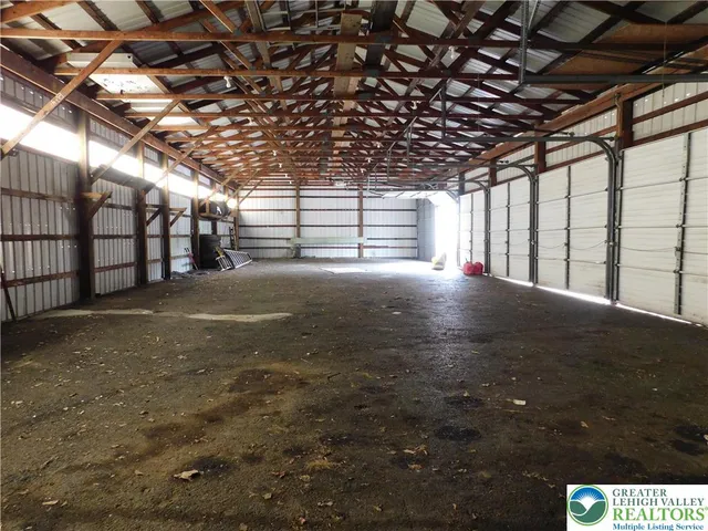 a view of an empty room with windows