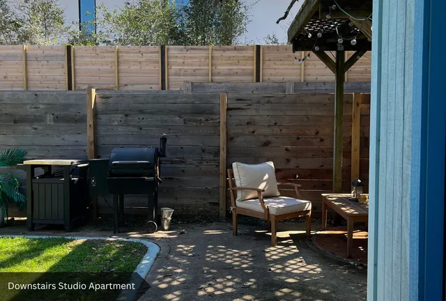 a living room with furniture and a rug