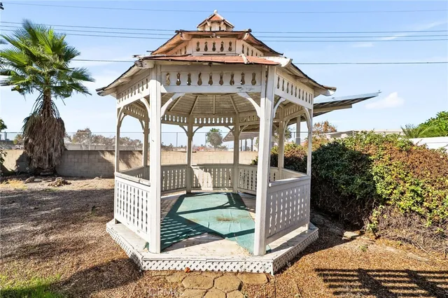 a view of a patio with couches chairs and potted plants