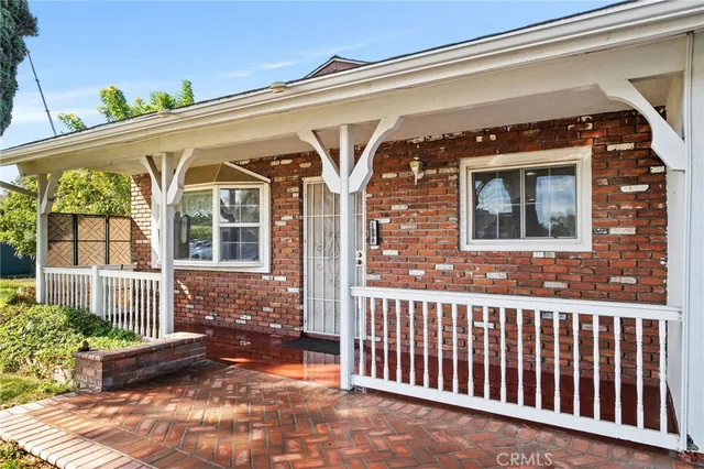 a front view of a house with a porch