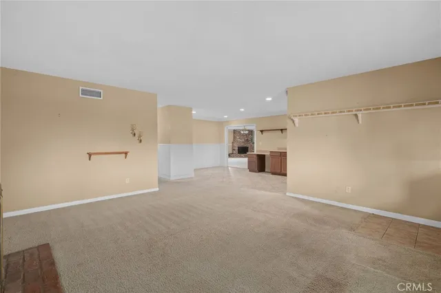 a view of a kitchen with a sink and a refrigerator