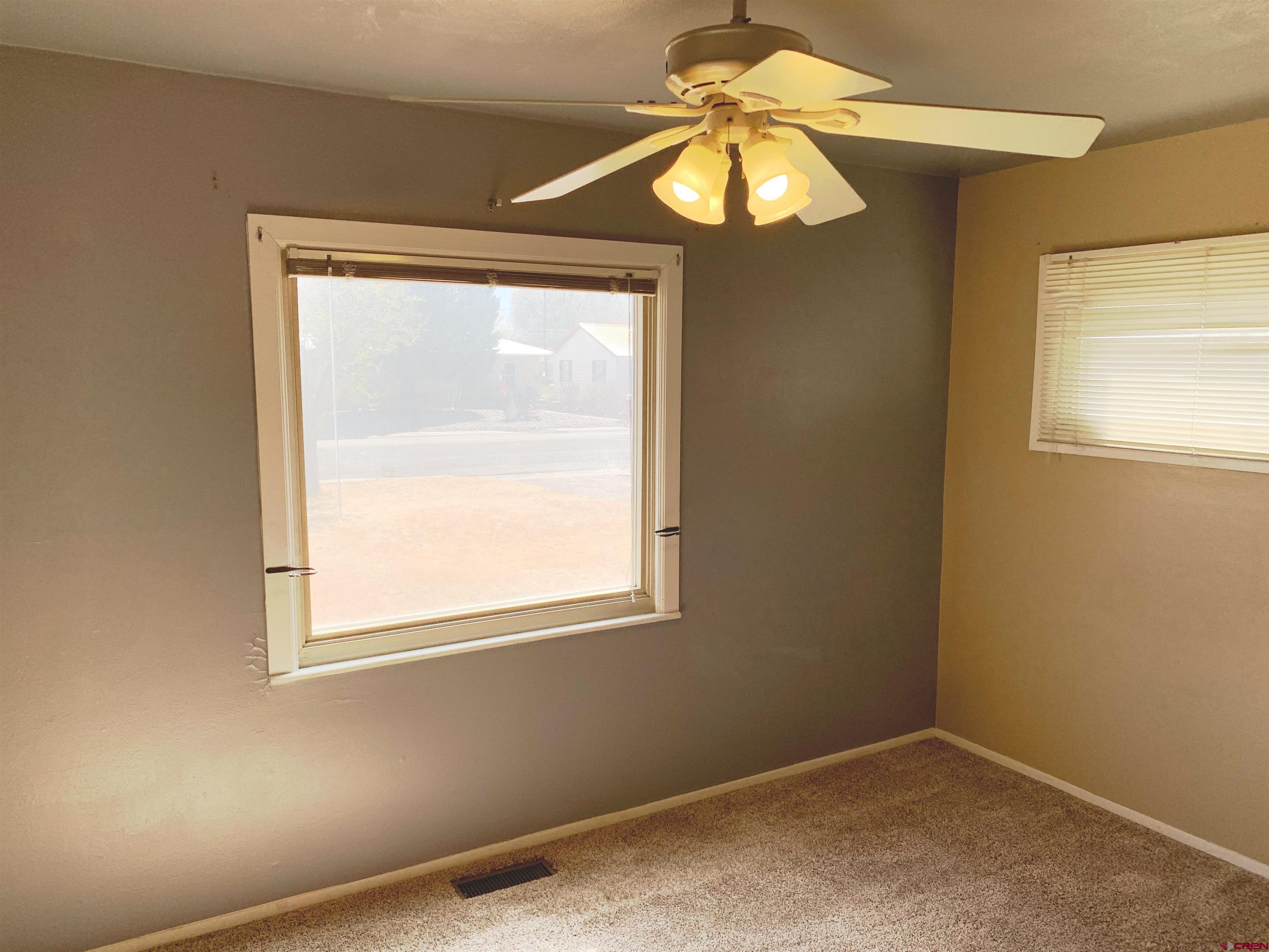 331 Morris Street Monte Vista, CO 81144 - Photo 18 of 31 an empty room with a window