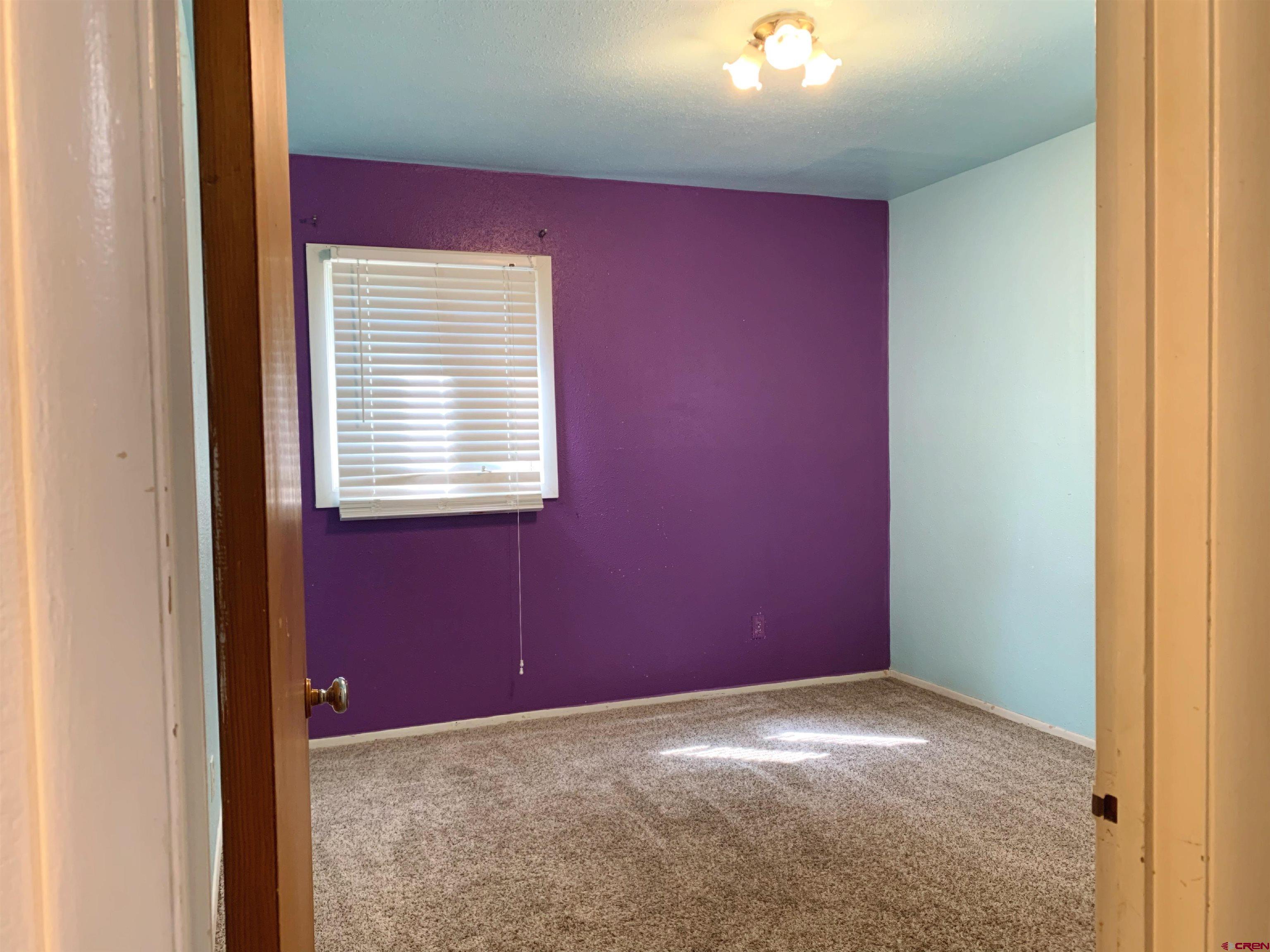 331 Morris Street Monte Vista, CO 81144 - Photo 22 of 31 a view of a livingroom with a window
