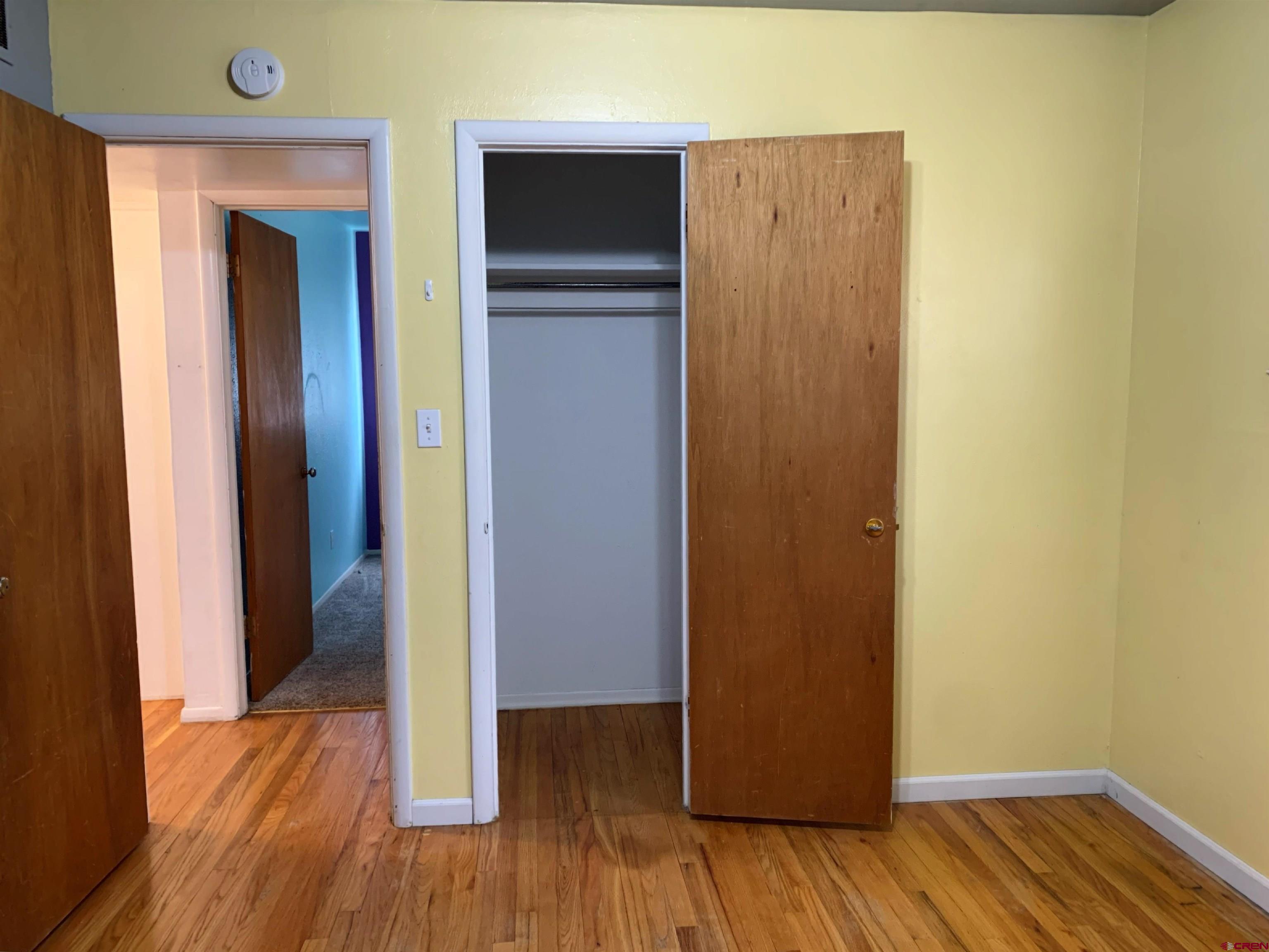 331 Morris Street Monte Vista, CO 81144 - Photo 23 of 31 a view of a hallway with wooden floor