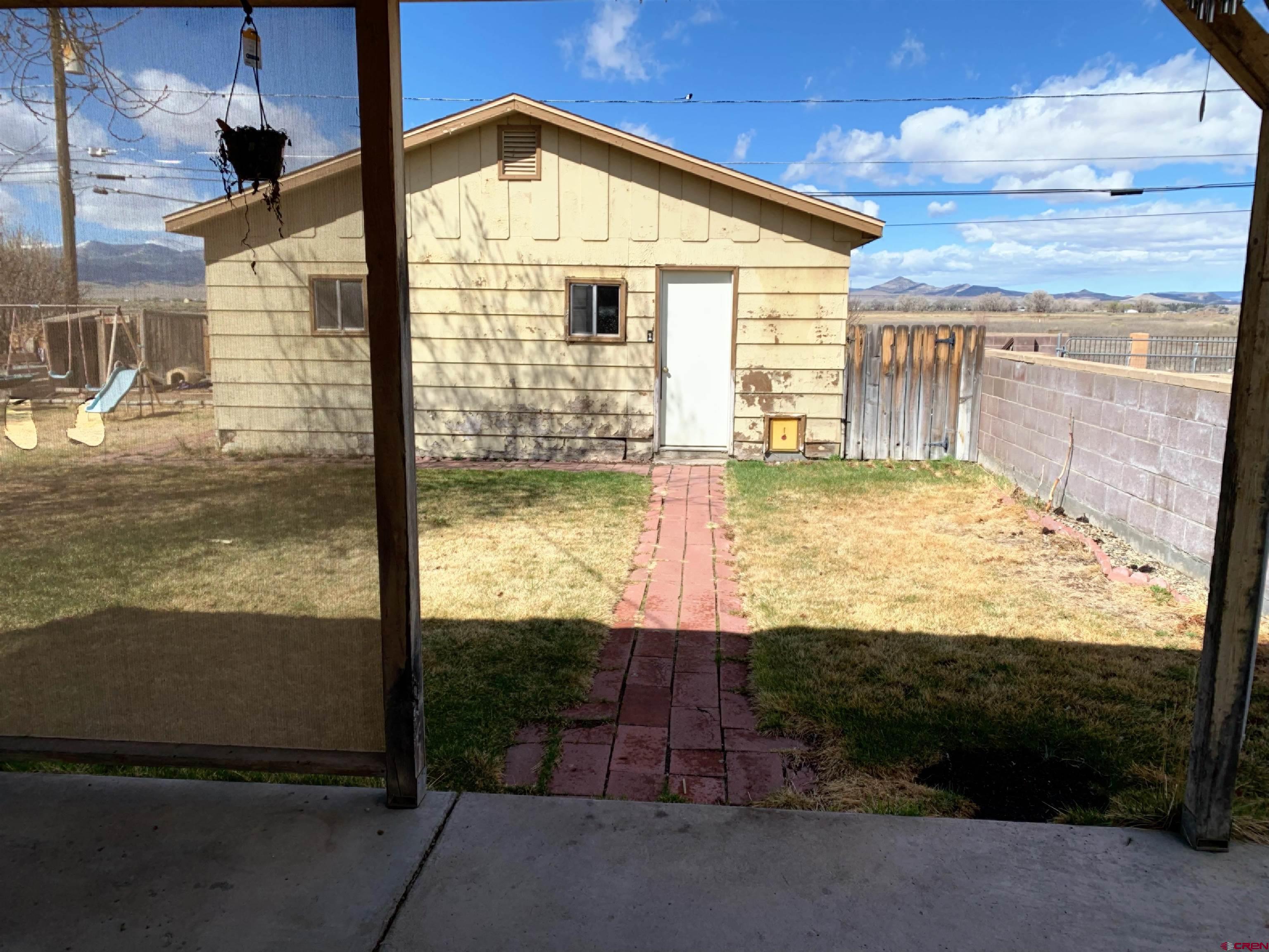 331 Morris Street Monte Vista, CO 81144 - Photo 28 of 31 a view of a backyard of the house
