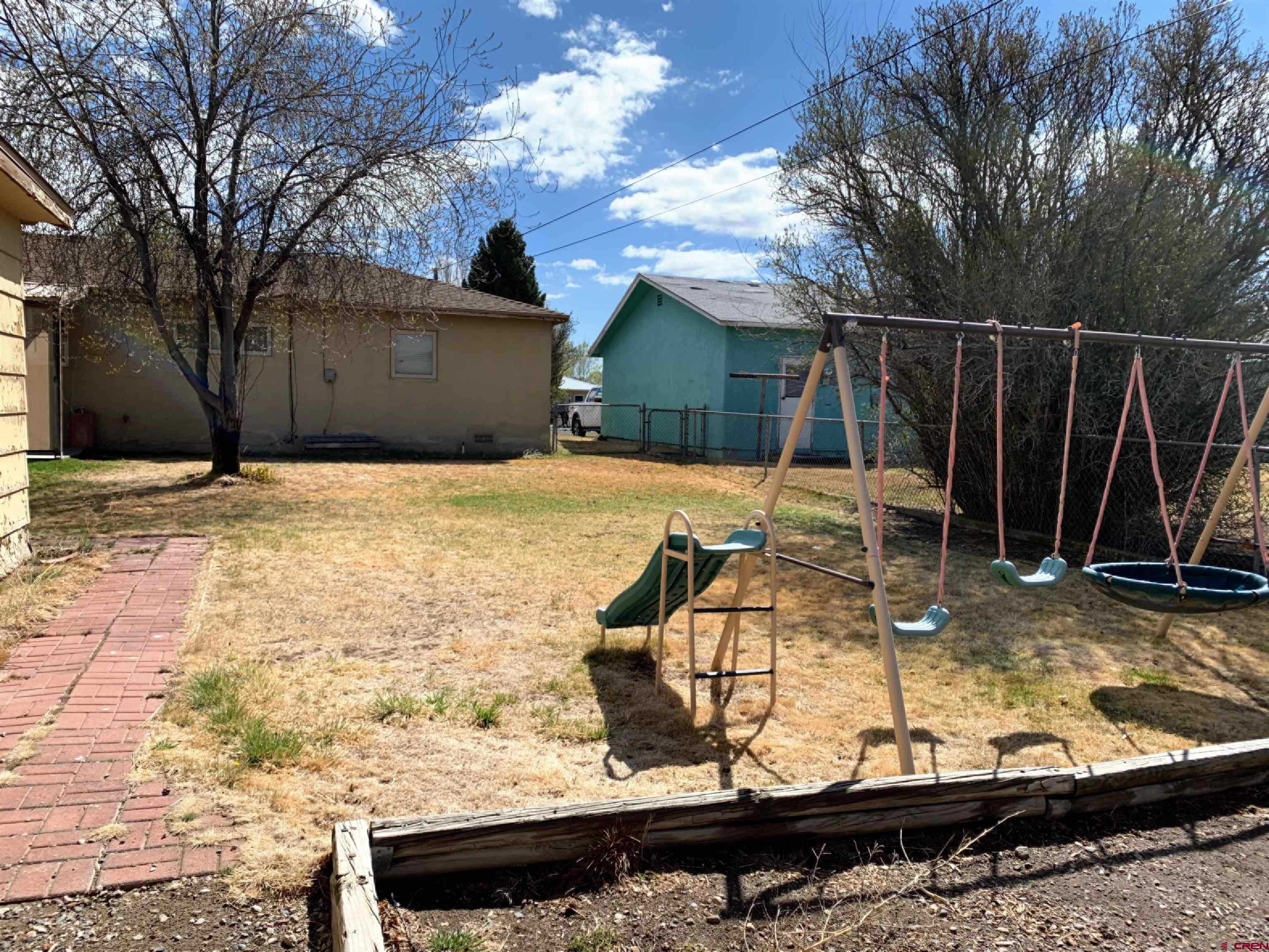 331 Morris Street Monte Vista, CO 81144 - Photo 30 of 31 a view of a backyard with chairs
