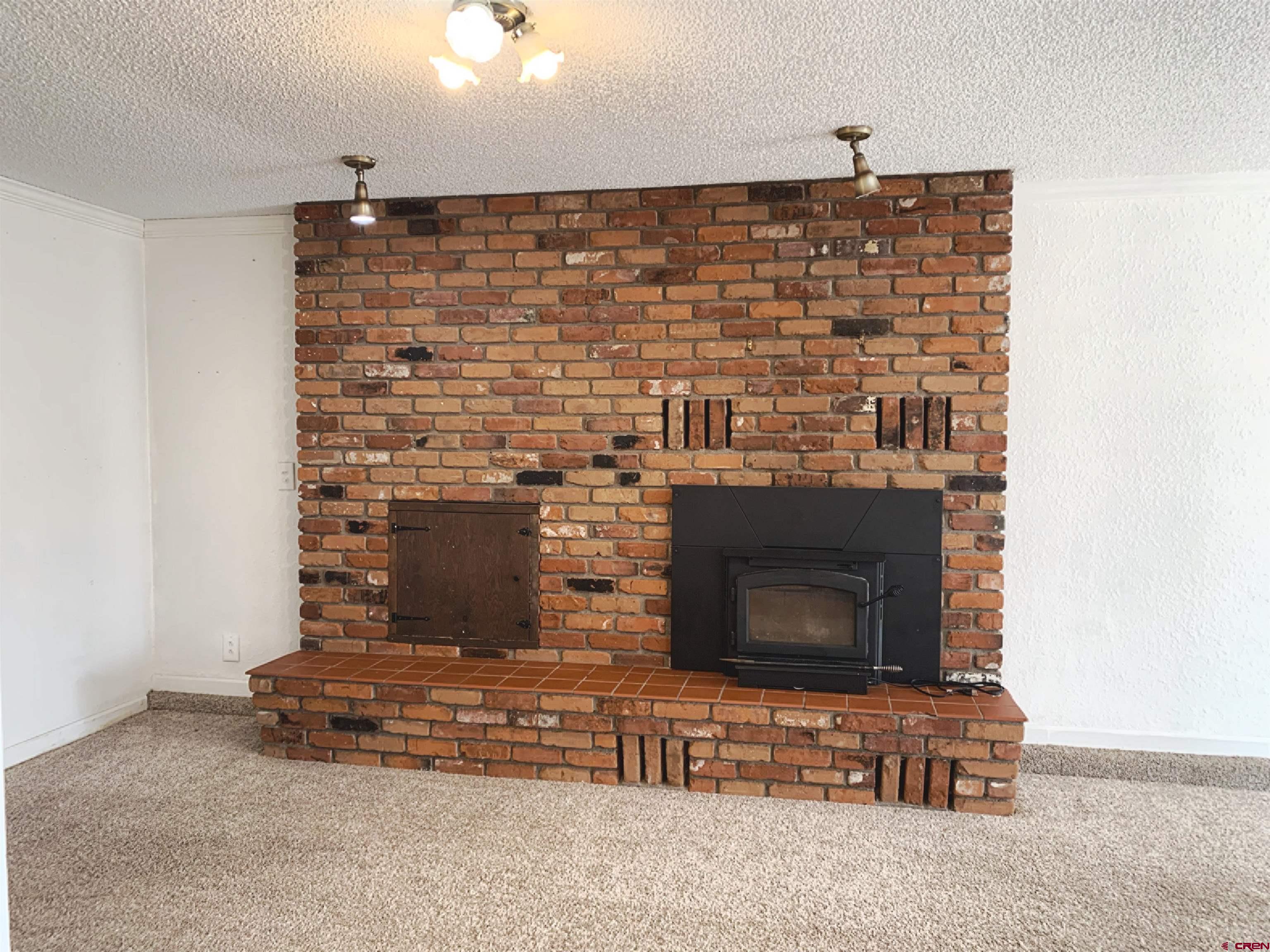331 Morris Street Monte Vista, CO 81144 - Photo 7 of 31 a view of fireplace
