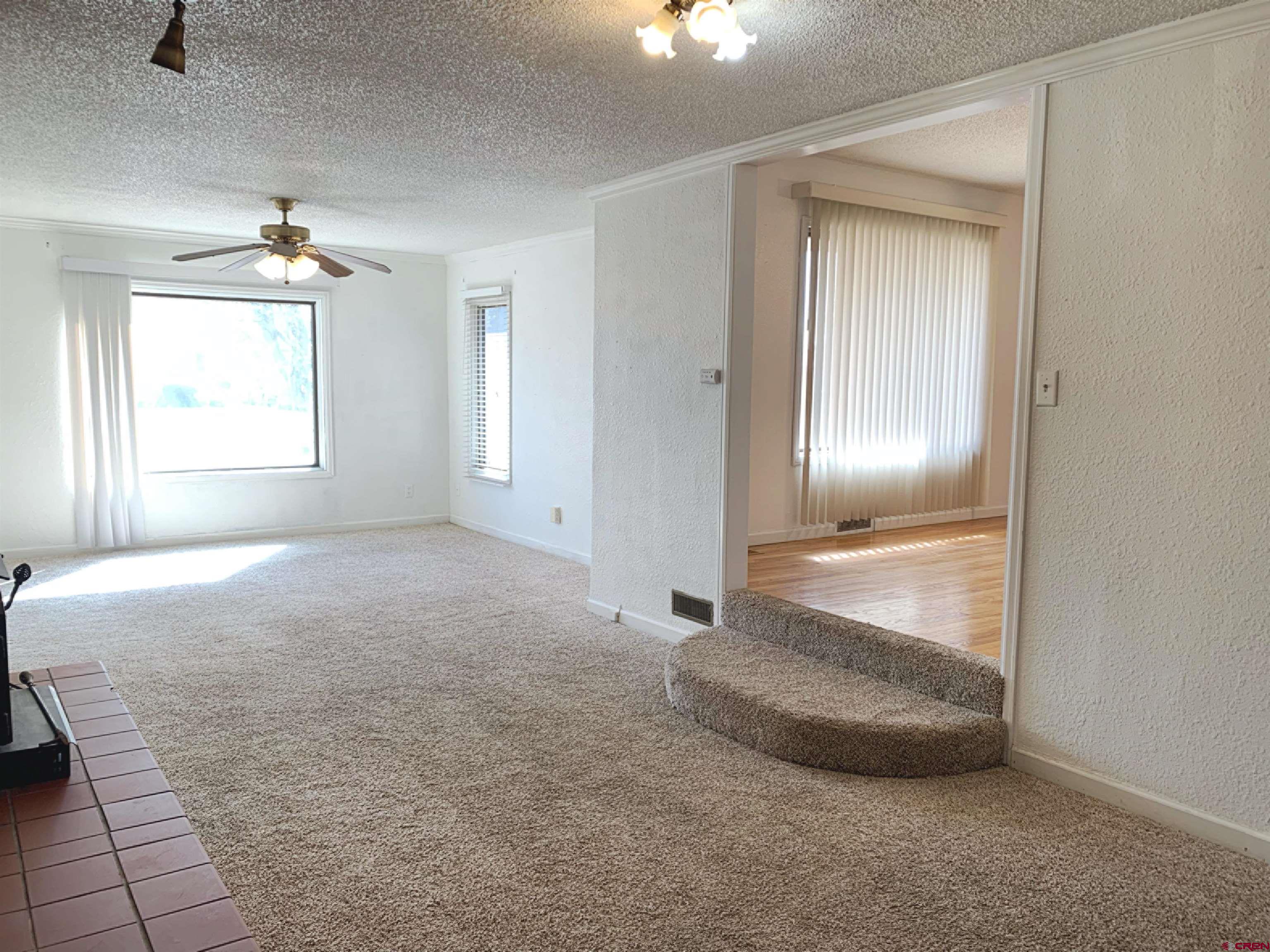 331 Morris Street Monte Vista, CO 81144 - Photo 8 of 31 an empty room with windows and closet