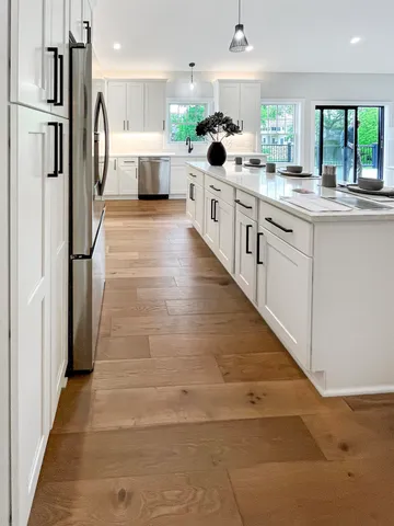 a view of a house with a yard and sitting area
