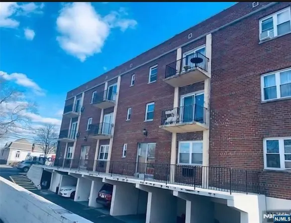 a front view of a building with a lot of windows