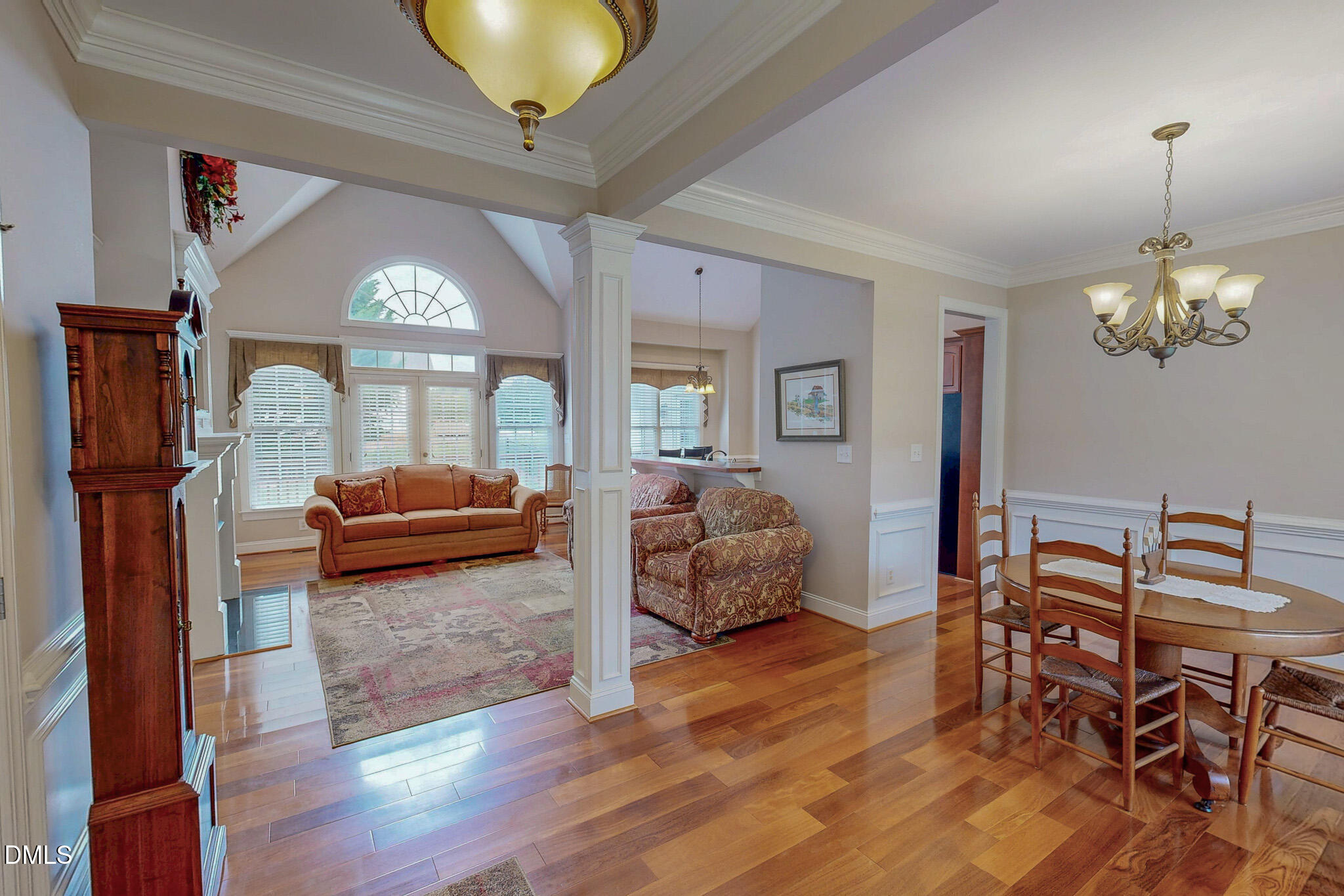 115 Duncan Plantation Road Timberlake, NC 27583 - Photo 7 of 48 a living room with furniture and a chandelier