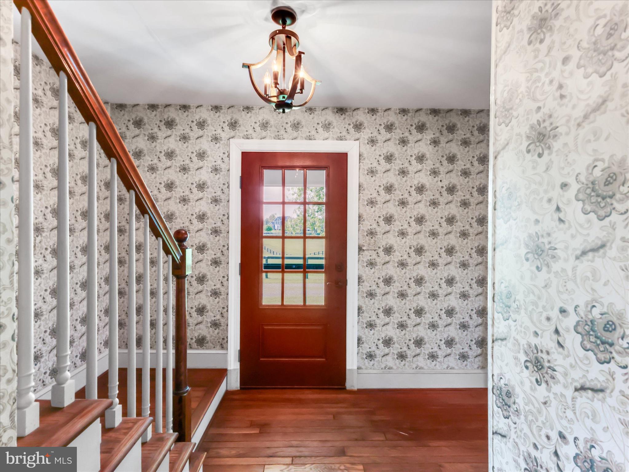 19255 Telegraph Springs Road Purcellville, VA 20132 - Photo 98 of 107 a view of a hallway with wooden floor and staircase
