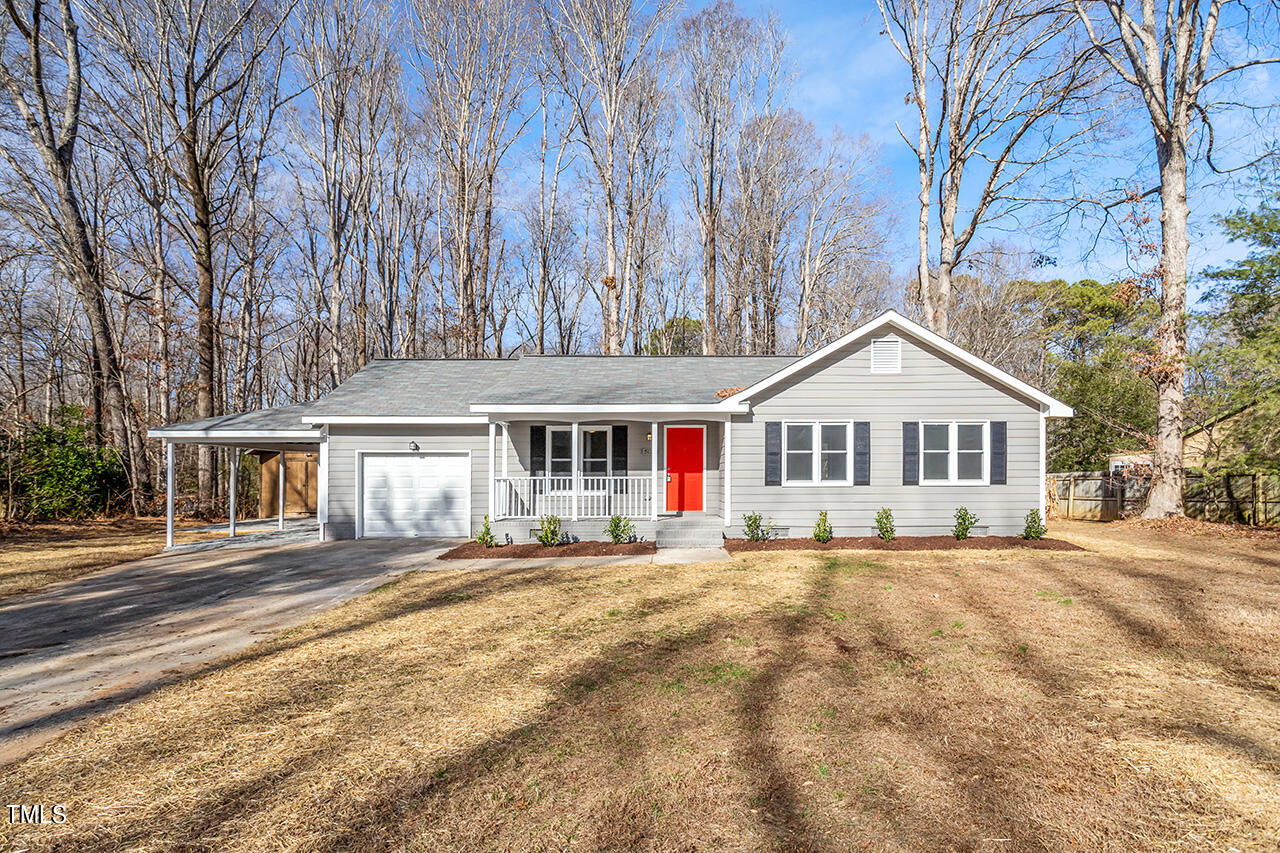5137 Shield Circle Raleigh, NC 27603 - Photo 1 of 36 a front view of a house with a yard