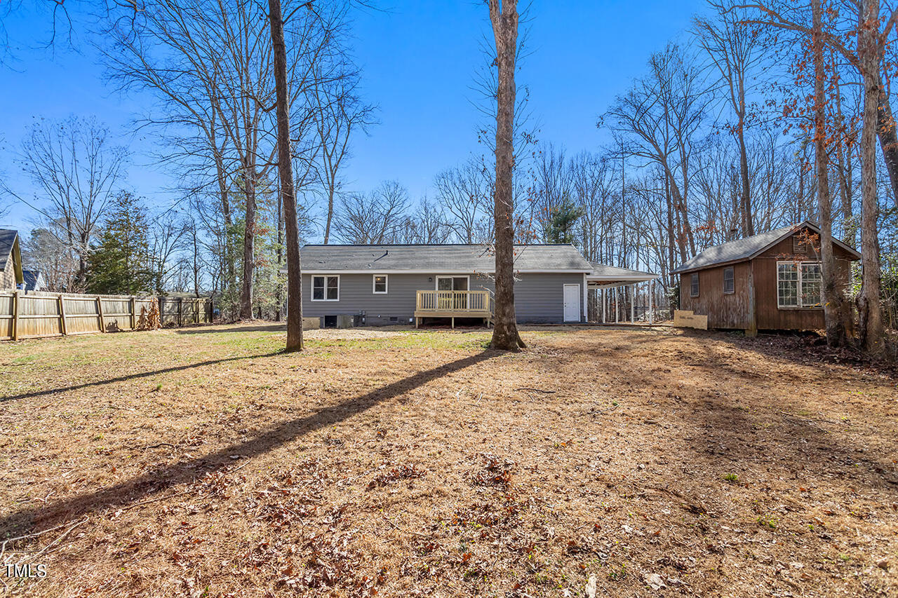 5137 Shield Circle Raleigh, NC 27603 - Photo 26 of 36 a house with trees in front of it