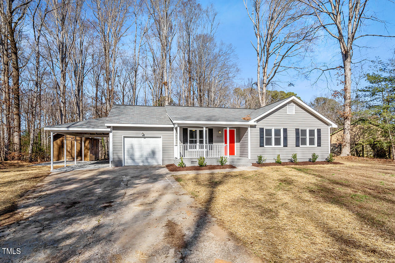 5137 Shield Circle Raleigh, NC 27603 - Photo 29 of 36 a front view of a house with a yard