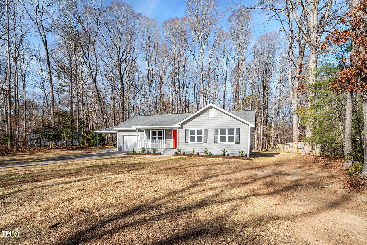 5137 Shield Circle Raleigh, NC 27603 - Photo 33 of 36 a front view of a house with a yard