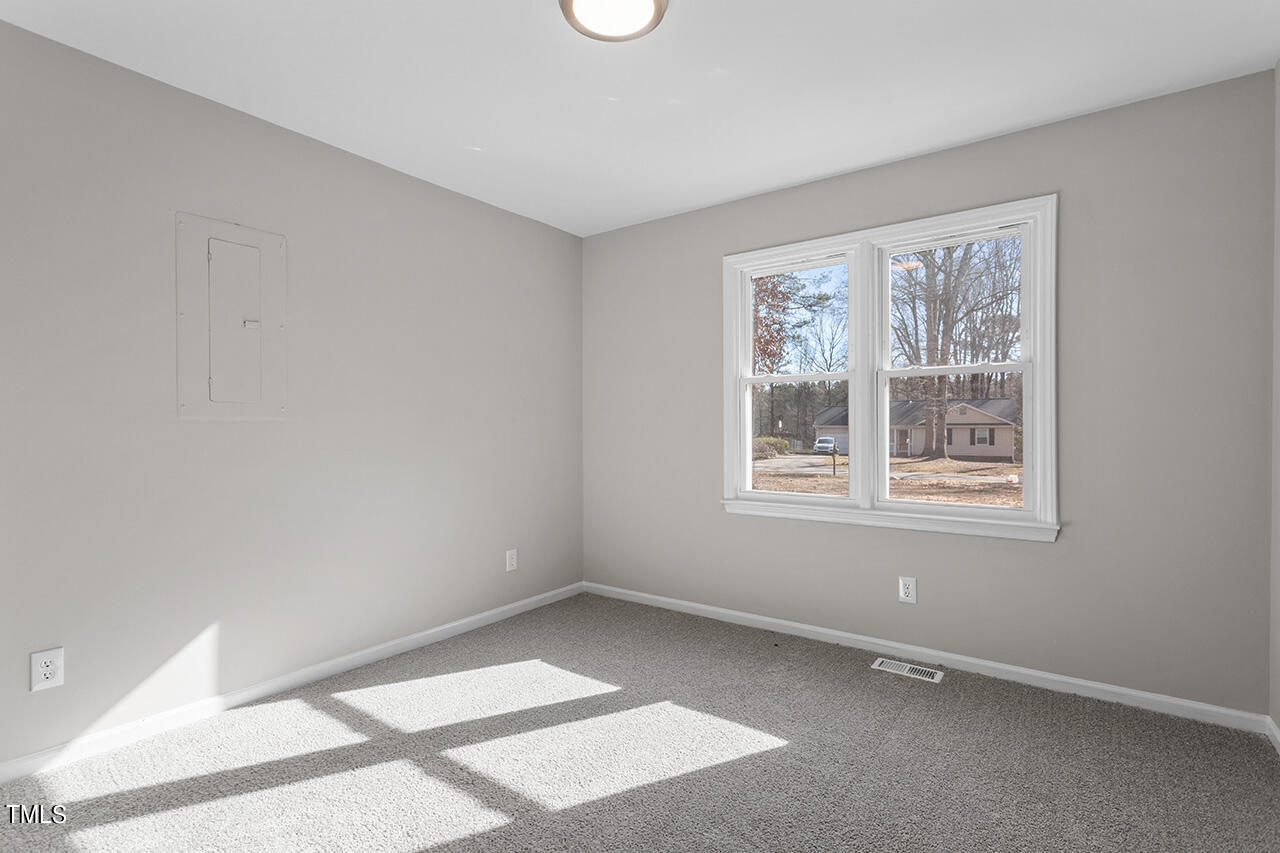 5137 Shield Circle Raleigh, NC 27603 - Photo 8 of 36 a view of an empty room with a window