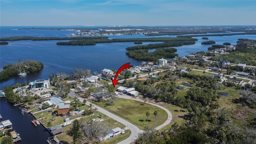 1019 Canal Street Ruskin, FL 33570 - Photo 31 of 52 an aerial view of a house with a yard and lake view
