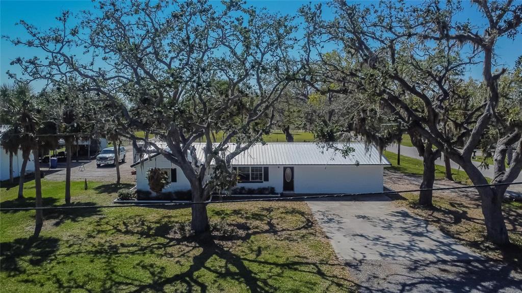 1019 Canal Street Ruskin, FL 33570 - Photo 50 of 52 a front view of a house with garden