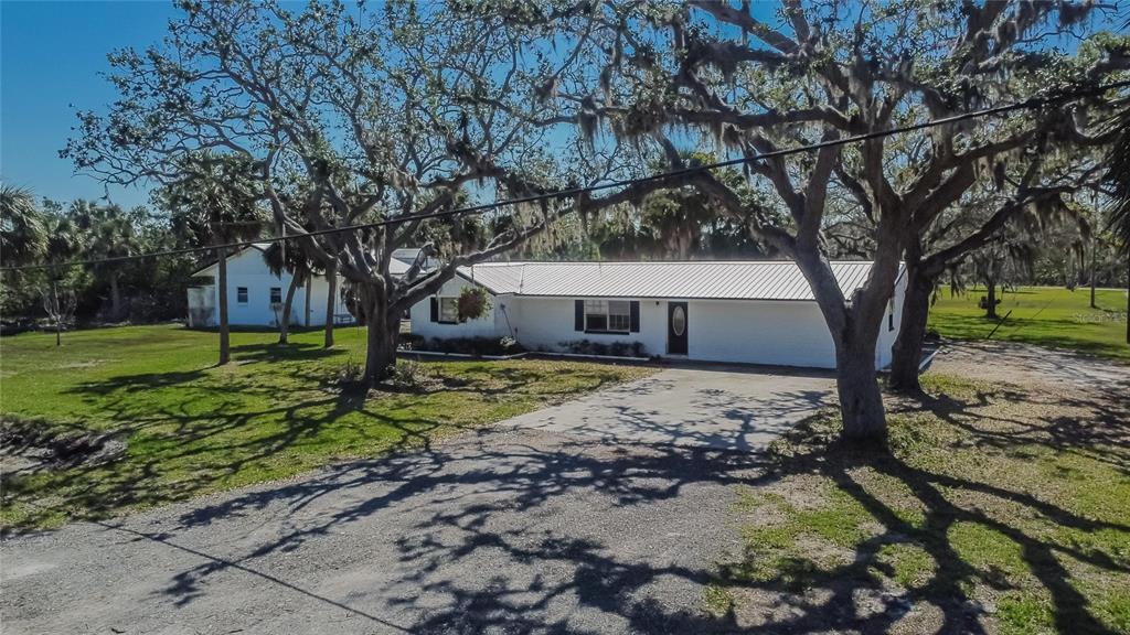 1019 Canal Street Ruskin, FL 33570 - Photo 51 of 52 a view of a house with a yard