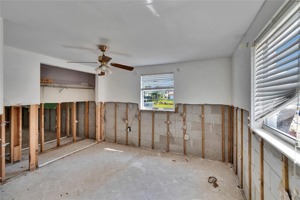 1019 Canal Street Ruskin, FL 33570 - Photo 10 of 52 an empty room with windows and cabinet