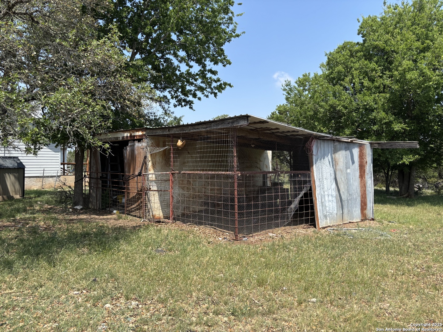 725 Lonesome Loop Blanco, TX 78606 - Photo 15 of 26 a view of a house with a garage