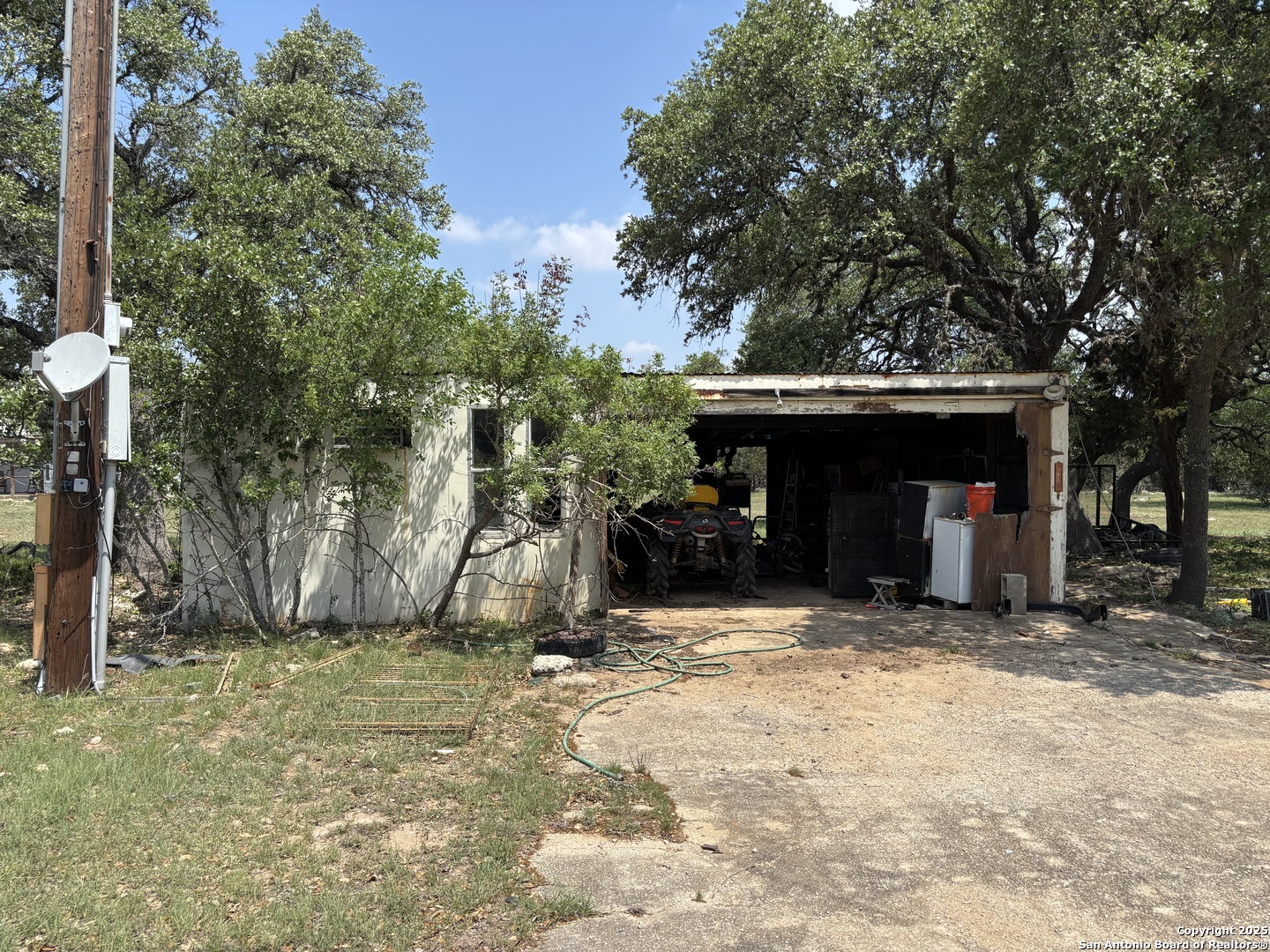 725 Lonesome Loop Blanco, TX 78606 - Photo 18 of 26 a view of a car park in front of house