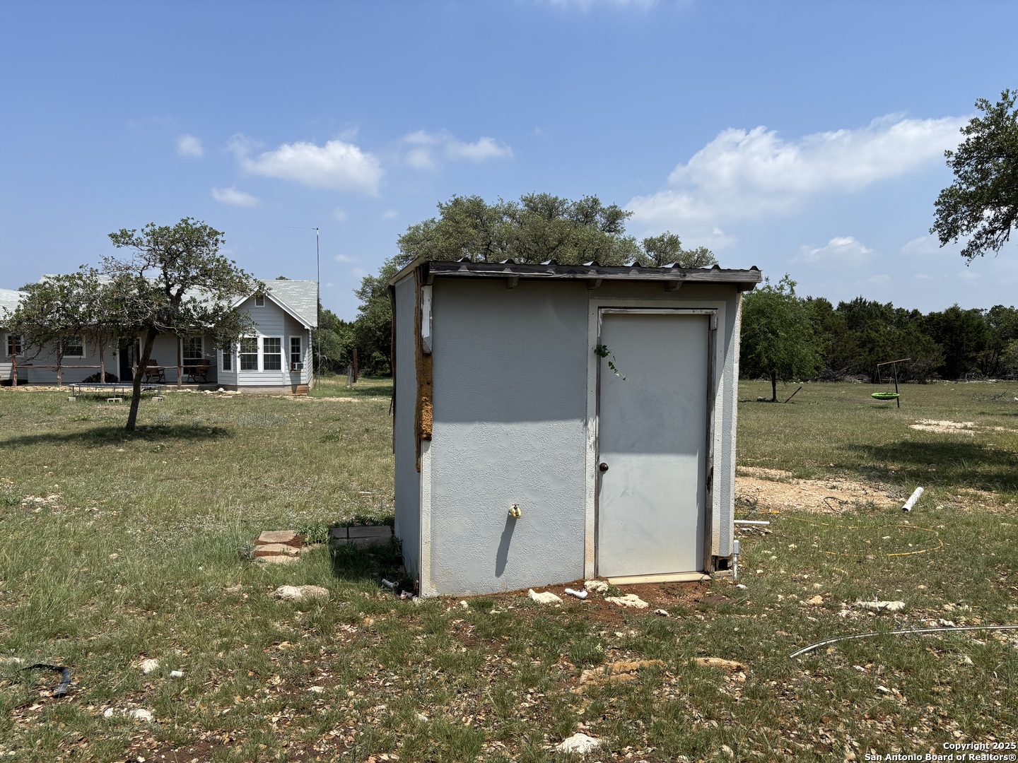725 Lonesome Loop Blanco, TX 78606 - Photo 20 of 26 a view of a house with a yard