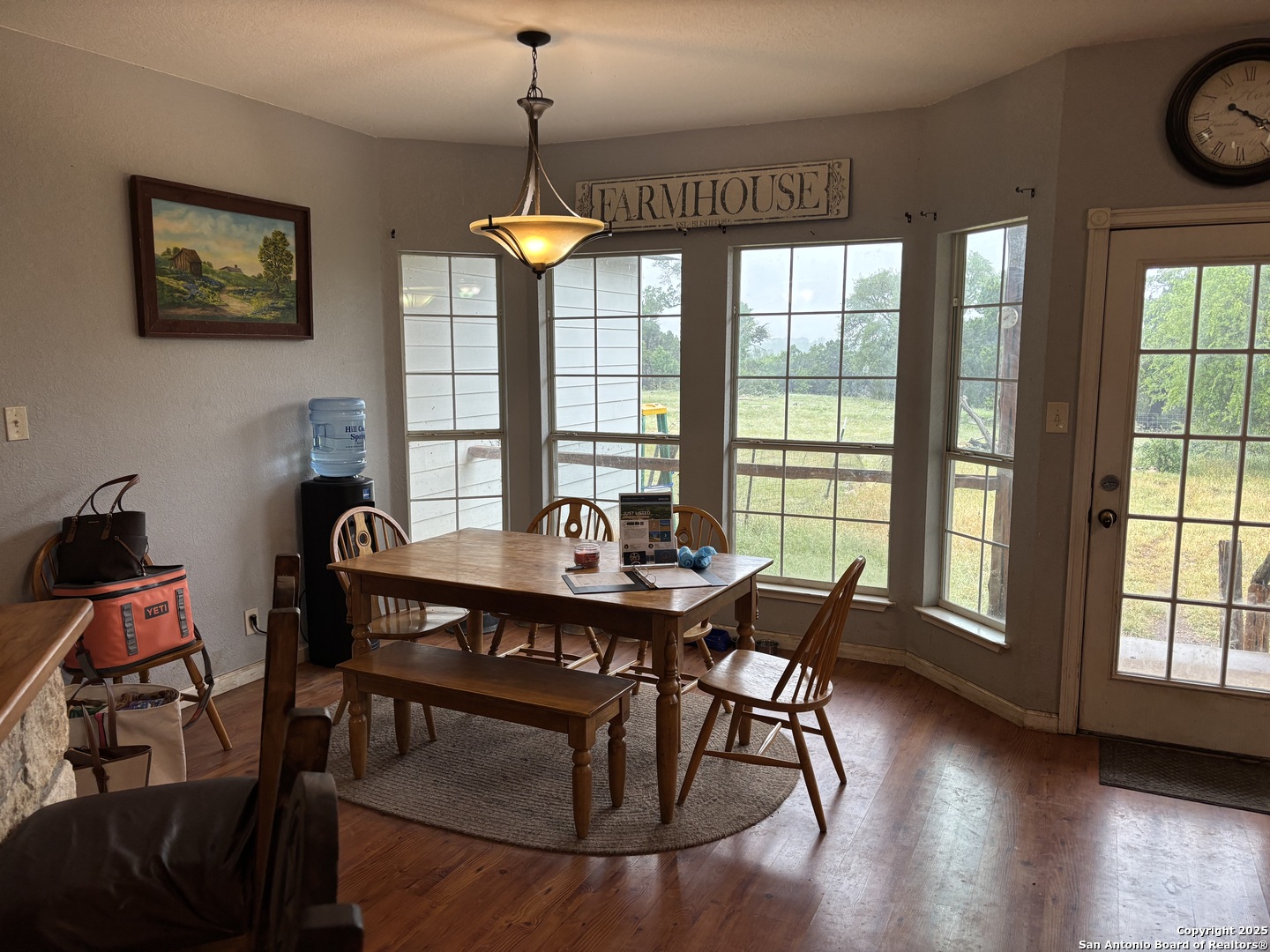 725 Lonesome Loop Blanco, TX 78606 - Photo 6 of 26 a view of a dining room with furniture window and wooden floor