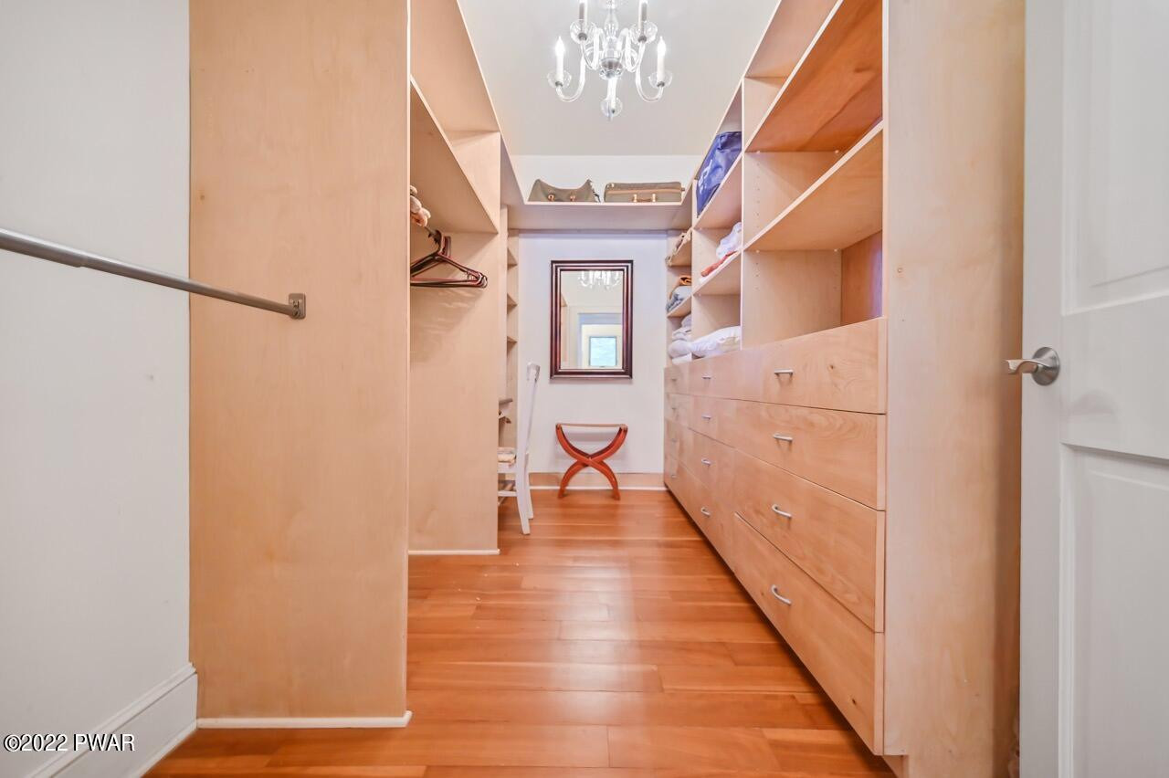 45 Tammany Flats Road Damascus, PA 18415 - Photo 49 of 73 a hallway with wooden floor chandelier and livingroom