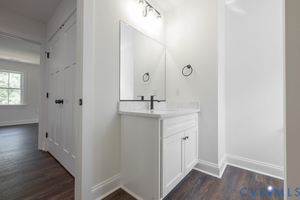 Lot 6 Tabscott Road Columbia, VA 23038 - Photo 34 of 42 Bathroom with dark wood-style floors and vanity