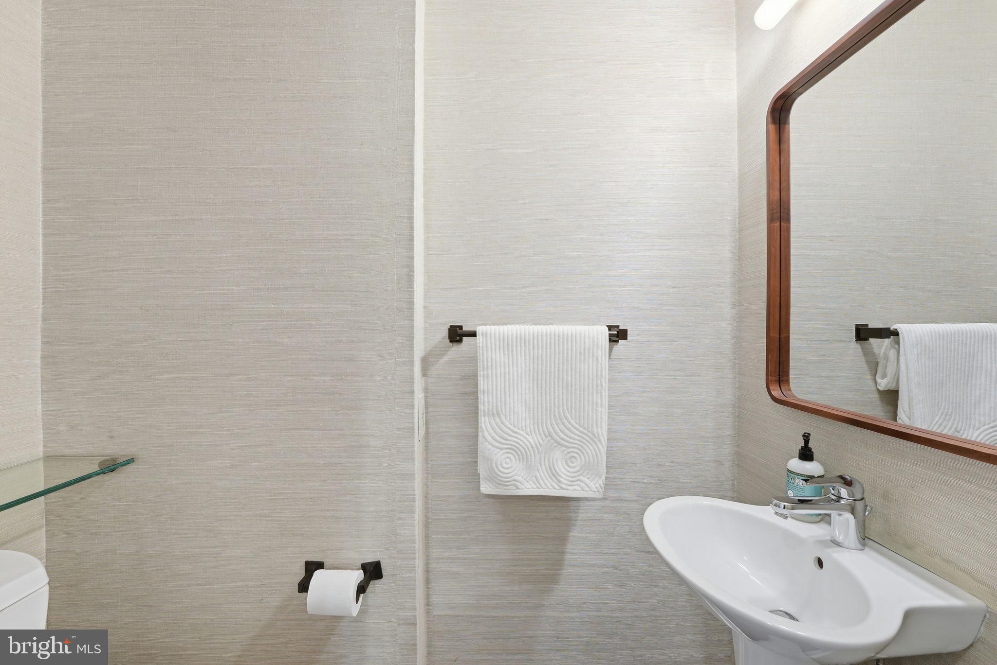 3512 30th Street Northwest Washington, DC 20008 - Photo 11 of 41 a bathroom with a sink and a mirror