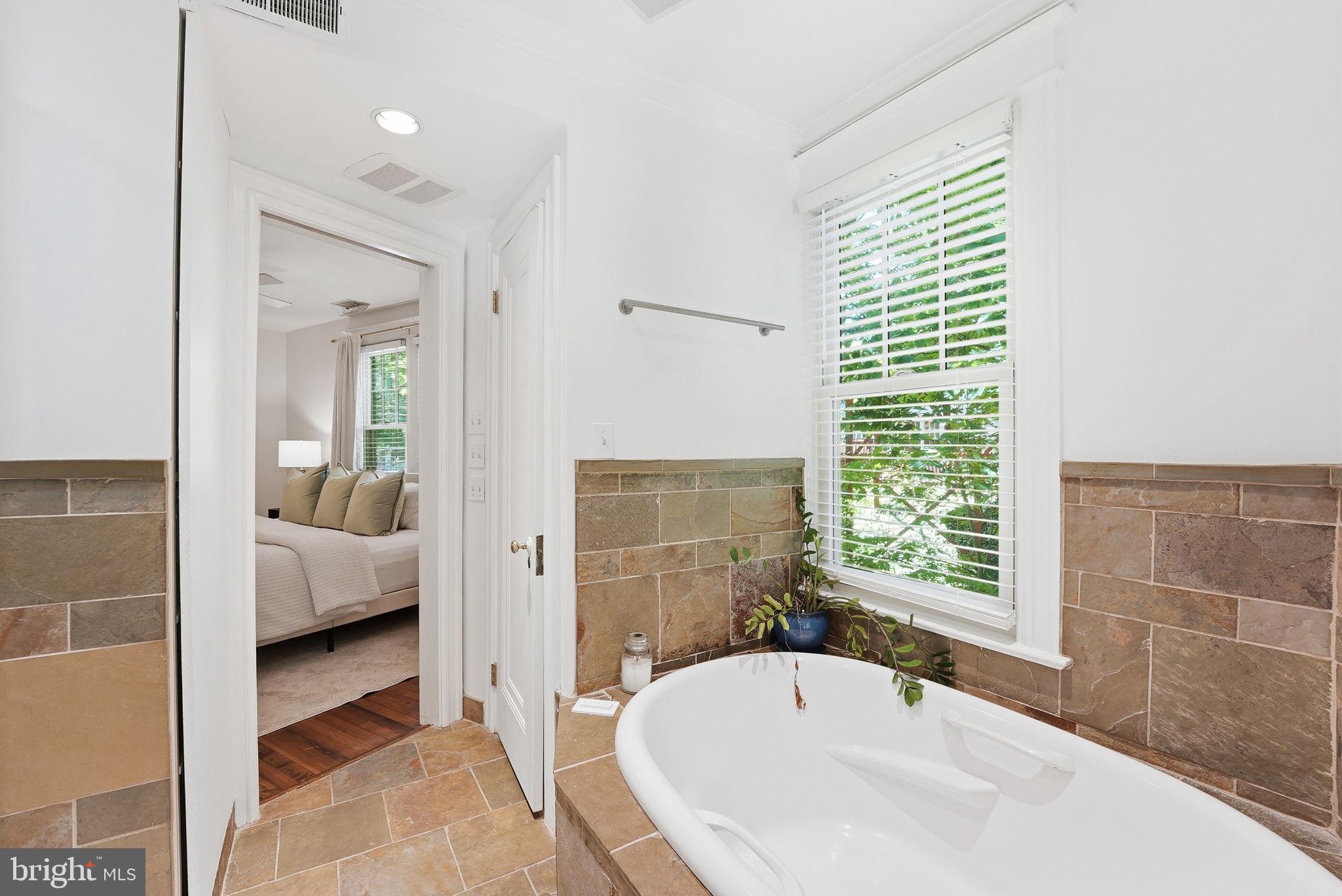 3512 30th Street Northwest Washington, DC 20008 - Photo 21 of 41 a bathroom with a tub sink and shower