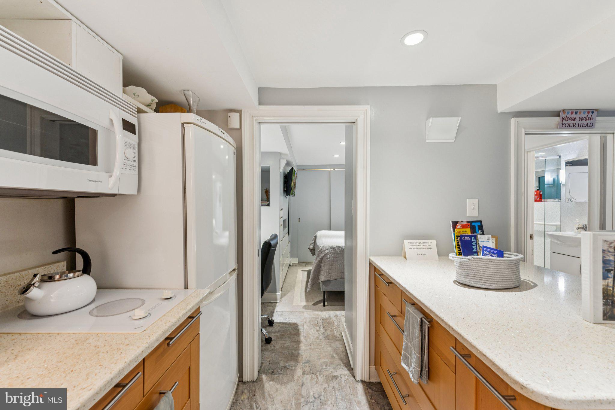 3512 30th Street Northwest Washington, DC 20008 - Photo 33 of 41 a kitchen with a sink and refrigerator
