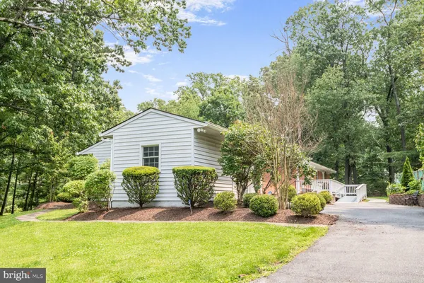 a view of house with yard